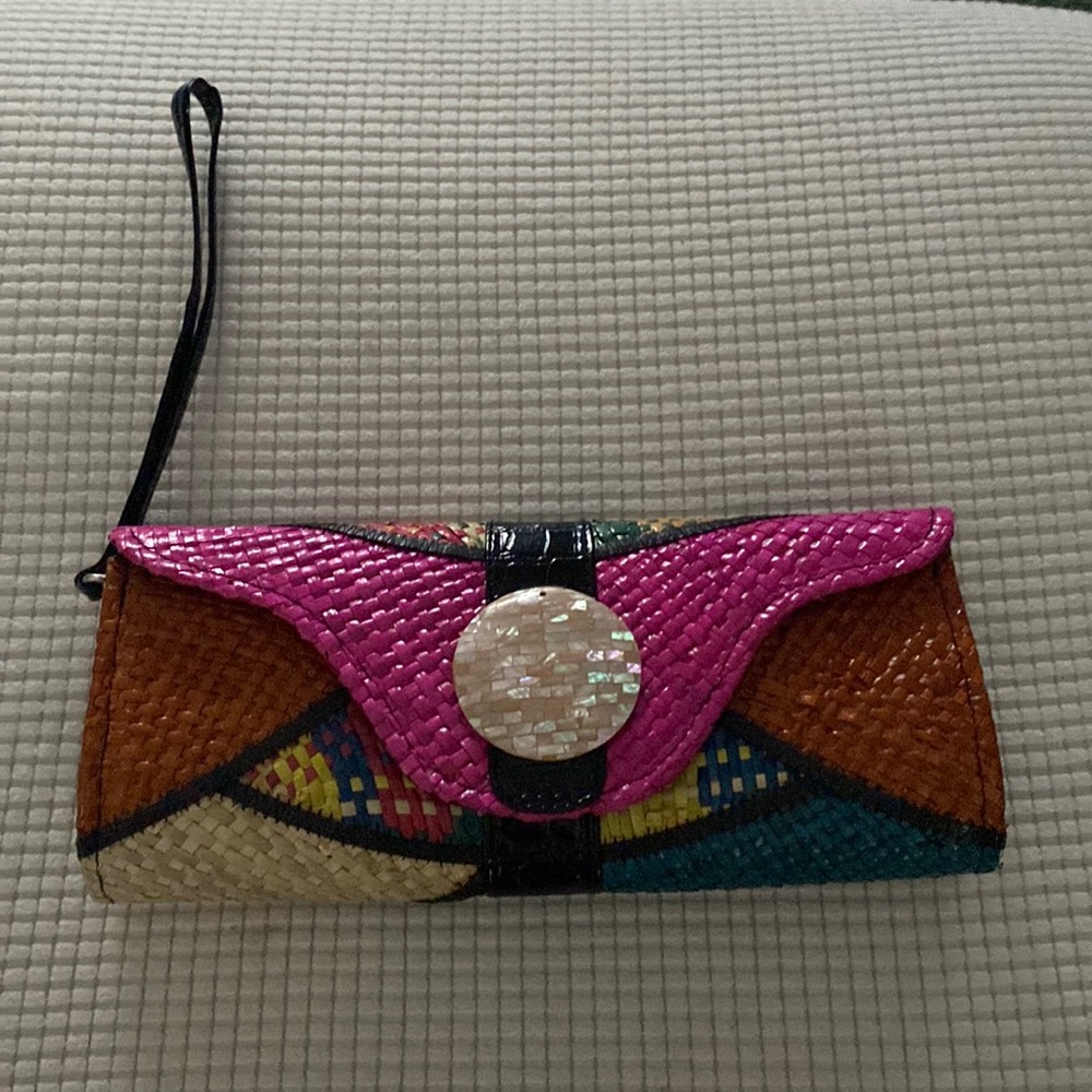 Beautiful clutch purse with mother of pearl in the front.